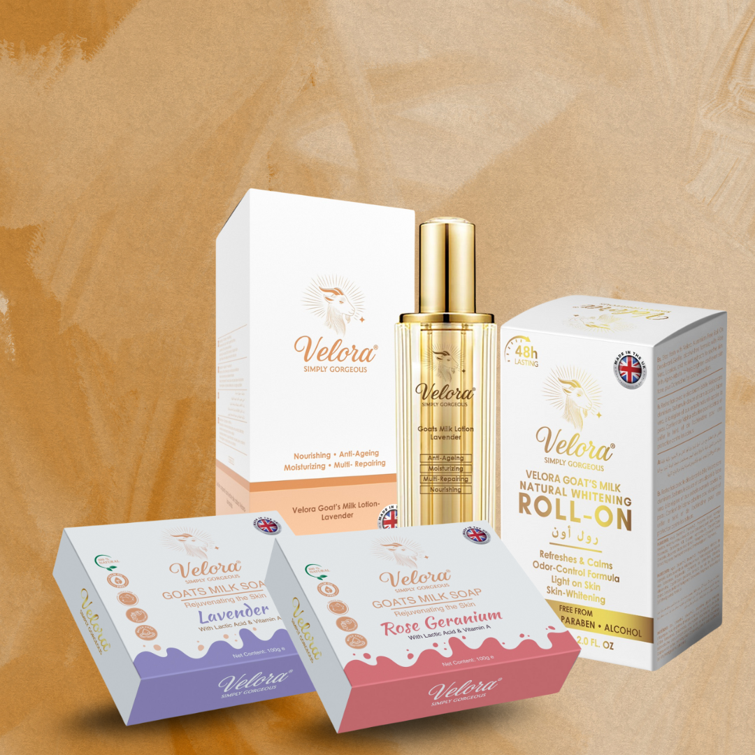 Velora goat-milk skincare products displayed on a table — lotions, soaps, body care packaging.