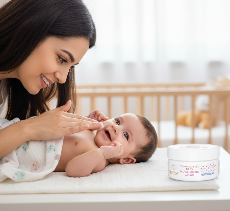Mom applying Velora Baby Moisturizing Cream for soft, hydrated baby skin